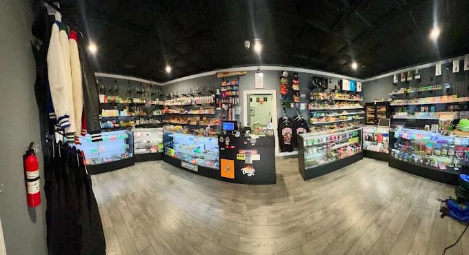 Inside the store — the counter and the full wall of stock